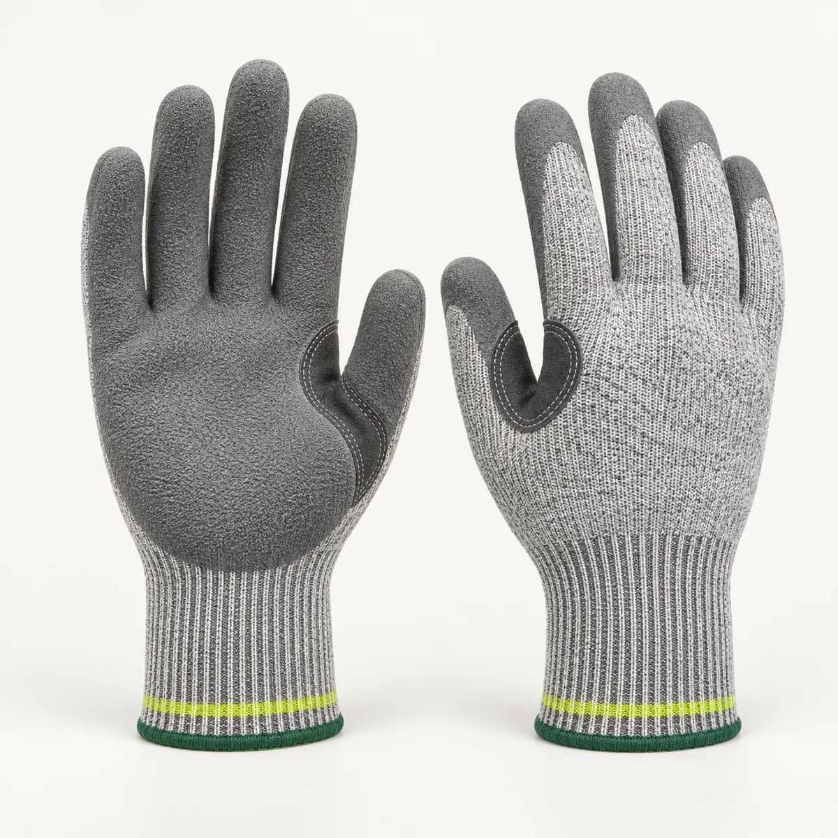 Grey knit work gloves with textured coated palm, reinforced thumb crotch and ribbed cuff